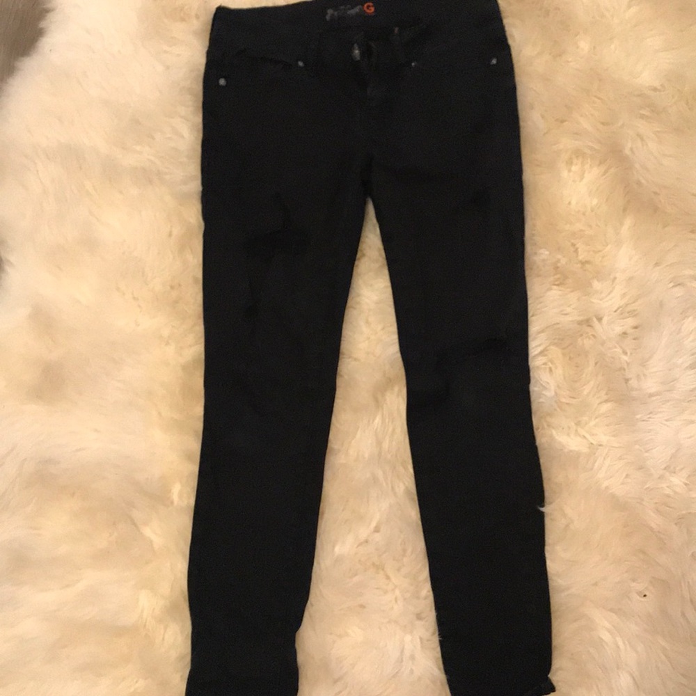 Torn black jeans